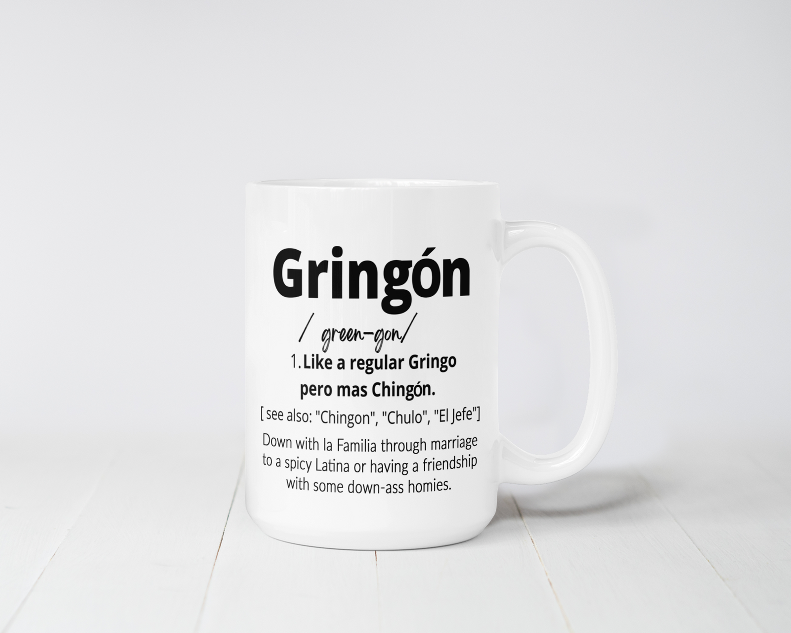 White ceramic mug with bold black text that reads “Gringón – Like a regular Gringo pero más Chingón,” styled with a humorous definition and Latino cultural flair. 15 oz capacity, microwave and dishwasher safe.